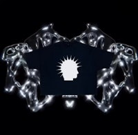 a black t - shirt with a white head on it